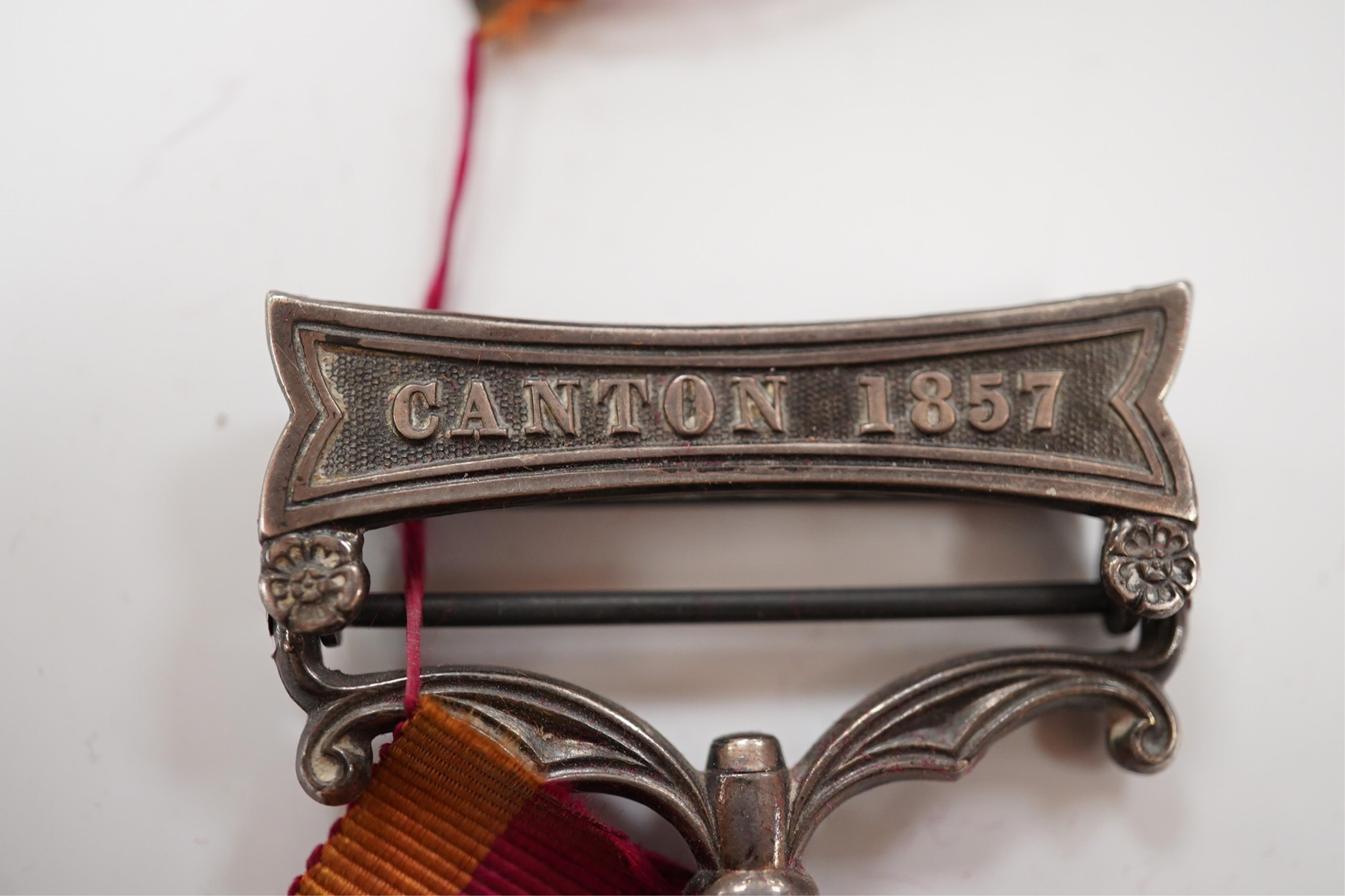 A Second China War Medal 1861 with Canton 1857 clasp, unnamed, navy issue.